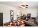 Living room featuring a fireplace, hardwood floors and large windows at 4163 Citizen Cir, Austell, GA 30106