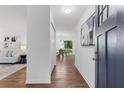Bright and airy entryway with hardwood floors, leading to the living and dining areas at 1921 Westwood Sw Ave, Atlanta, GA 30310