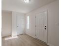 Bright and airy entryway with light wood flooring and an open feel at 1990 Old Concord Se Dr, Covington, GA 30016