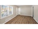 Spacious living area with wood-look floors and large windows at 2077 Rosewood Rd, Decatur, GA 30032