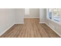 Bright living room featuring wood-look floors and neutral walls at 2077 Rosewood Rd, Decatur, GA 30032