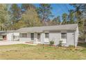 Lovely home with a painted gray brick exterior, featuring a well kept front yard and curb appeal at 2649 Santa Barbara Nw Dr, Atlanta, GA 30318