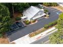 Aerial view showcasing ample parking, thoughtful landscaping, and the building's overall layout within its setting at 4205 Jim Owens Nw Rd, Kennesaw, GA 30152