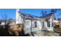 Rear view of house with wooden privacy fence and patio at 1432 Cutters Mill Dr, Lithonia, GA 30058