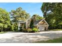 House with a detached garage and side yard at 2100 Davis Academy Rd, Rutledge, GA 30663