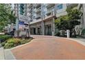 Modern building exterior with landscaped entryway and signage at 250 Pharr Ne Rd # 507, Atlanta, GA 30305