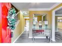 Bright entryway with a red door and a mirrored console table at 3447 Portsmouth Cir, Stonecrest, GA 30038