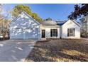 Newly renovated two-car garage home with a yard at 4100 Chanticleer Nw Dr, Kennesaw, GA 30152