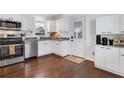 Modern kitchen with stainless steel appliances and white cabinets at 390 Cascade Nw Dr, Marietta, GA 30064