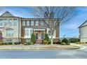 Attractive brick townhome with double front doors and manicured landscaping at 4323 Tacoma Trce, Suwanee, GA 30024