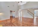 Two-story living room with hardwood floors and staircase at 1450 Grovehurst Dr, Marietta, GA 30062