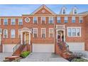 Three story brick townhome with attached garage and walkway at 2428 Bridlewood Se Dr # 24, Atlanta, GA 30339