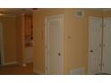 Hallway with doors and neutral colored walls at 306 Flagstone Way # 306, Austell, GA 30168