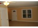 Bright living room with tile floors and neutral walls at 306 Flagstone Way # 306, Austell, GA 30168