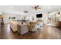 Spacious living room with hardwood floors and multiple seating areas at 103 Cardinal Se Rd, White, GA 30184