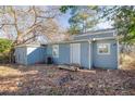 Rear view of house showing detached structure and yard at 1095 Mcdaniel Sw St, Atlanta, GA 30310