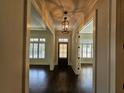 Bright entryway with hardwood floors and elegant light fixture at 5981 Brundage Ln, Norcross, GA 30071