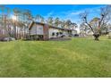 A view of the home's green backyard lawn at 4847 Lakewood Dr, Acworth, GA 30101