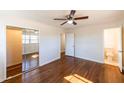 Bright bedroom with hardwood floors and mirrored closet doors at 850 Briarwood Trl, Douglasville, GA 30134