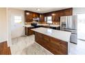 Renovated kitchen with island, stainless steel appliances, and wood cabinets at 850 Briarwood Trl, Douglasville, GA 30134