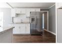 Modern kitchen featuring stainless steel appliances, granite countertops and white cabinets at 1268 Kenilworth Sw Dr, Atlanta, GA 30310