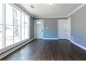 Bright living room with hardwood floors and large windows that let in natural light at 1268 Kenilworth Sw Dr, Atlanta, GA 30310
