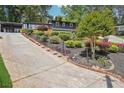 View of the lovely landscaped front yard and driveway of this attractive two-story home at 2139 Cedarbrook Se Ct, Atlanta, GA 30316