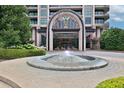 Luxury building entrance with fountain at 750 Park Ne Ave # 6E, Atlanta, GA 30326