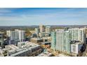 Aerial perspective of a high-rise building in a vibrant urban location at 250 Pharr Rd # 712, Atlanta, GA 30305