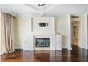 Living room fireplace with white mantel and stone surround at 2870 Pharr Court South Nw # 1205, Atlanta, GA 30305