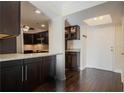 Modern kitchen with dark wood cabinets and granite countertops at 2870 Pharr Court South Nw # 1205, Atlanta, GA 30305