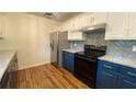 Modern kitchen with updated appliances and cabinetry at 312 W Downing Ct, Jonesboro, GA 30238
