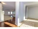Bright and spacious entryway with hardwood floors and views into the living room at 816 Royal Red Ct, Mcdonough, GA 30253