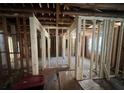 Under construction interior with exposed framing and flooring at 852 Laurelmont Sw Dr, Atlanta, GA 30311