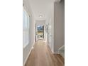 Bright hallway with light walls, wood-look floors, and access to the backyard at 237 Epping St # 89, Stockbridge, GA 30281