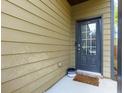 Back door entrance with a small patio at 4505 Ravenwood Dr, Union City, GA 30291
