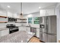 Modern kitchen with stainless steel appliances and granite countertops at 1003 Springdale Dr, Marietta, GA 30062