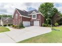 Brick home with three-car garage and basketball court at 2080 Misty Oaks Dr, Buford, GA 30519