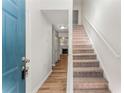 Inviting entryway with wood floors and staircase; the fireplace is visible in the background at 5845 Hampton Ct, Atlanta, GA 30349