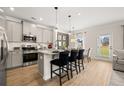 Modern kitchen with stainless steel appliances, granite counters, and island at 213 Bastian Dr # 6, Villa Rica, GA 30180