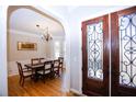 Formal dining room with hardwood floors, chandelier, and bay window at 1325 Starboard Way, Cumming, GA 30041