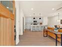Bright entryway with wood door opening to light-filled living area and kitchen at 702 Fairgate Rd, Marietta, GA 30064