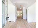 Bright entryway with light hardwood floors and neutral walls at 5649 Eagles Watch, Douglasville, GA 30135