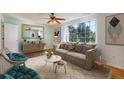 Bright living room with a large window, comfortable seating, and stylish decor creating a cozy and inviting atmosphere at 1931 Oana Sw St, Atlanta, GA 30310
