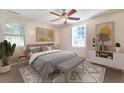 Serene main bedroom with ample natural light, a ceiling fan, and a neutral color palette, creating a relaxing retreat at 1931 Oana Sw St, Atlanta, GA 30310