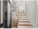 Front entry with stairs leading to the second floor at 4400 Ross Estates Ct, Snellville, GA 30039