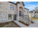 Brick home with a front entrance and staircase at 4400 Ross Estates Ct, Snellville, GA 30039