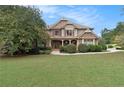 Charming two-story home with stone accents, a well-maintained lawn, and inviting curb appeal at 5669 Hollowbrooke Nw Ln, Acworth, GA 30101
