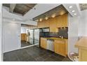 Modern kitchen with stainless steel appliances and wood cabinets at 2479 Peachtree Ne Rd # 1710, Atlanta, GA 30305