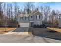 Inviting two-story home with an attached garage and a neatly landscaped front yard at 4770 Alford Commons, Cumming, GA 30028